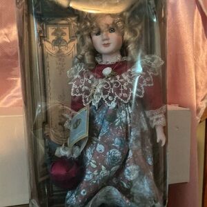 Elegant Porcelain Doll in Red Floral Dress